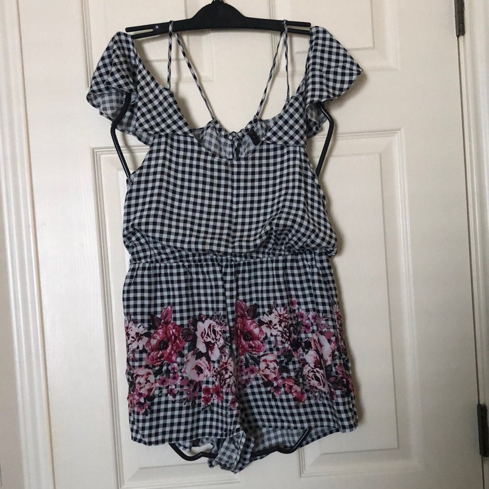 Stylish Black and White Gingham Romper with floral accent